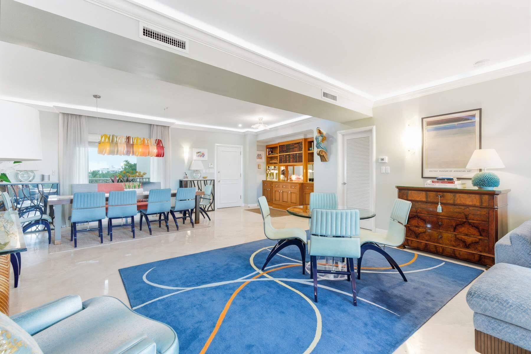 100 Royal Palm Way, Unit F4 Palm Beach, FL 33480 - Photo 8 of 28 a living room with furniture a dining table and a piano next to a window