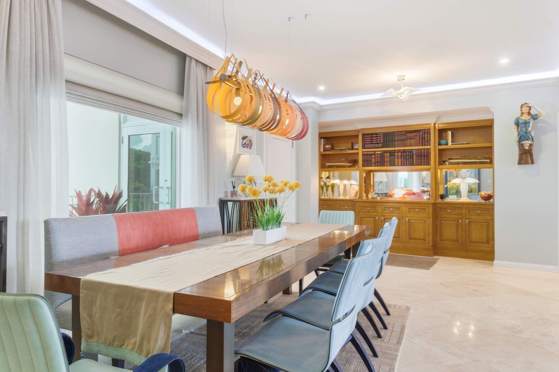 100 Royal Palm Way, Unit F4 Palm Beach, FL 33480 - Photo 10 of 28 a view of a dining room with furniture and window