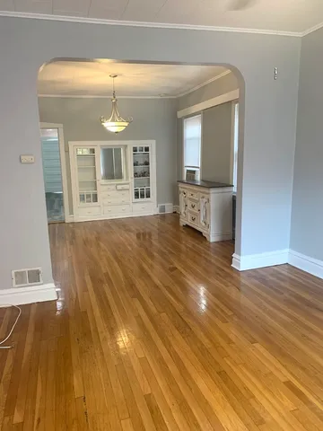 a view of a living room and wooden floor