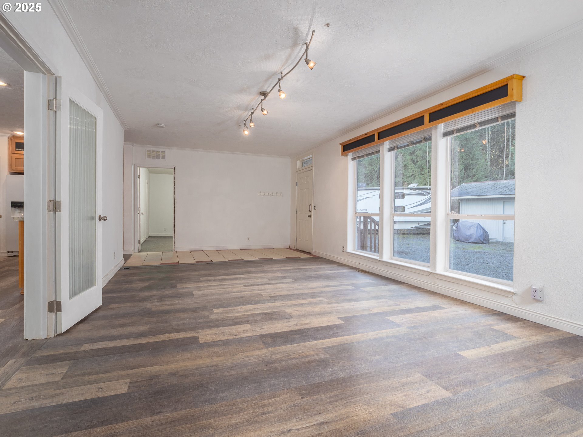 44300 Southeast Sandercock Lane Sandy, OR 97055 - Photo 11 of 48 en empty room with wooden floor and windows
