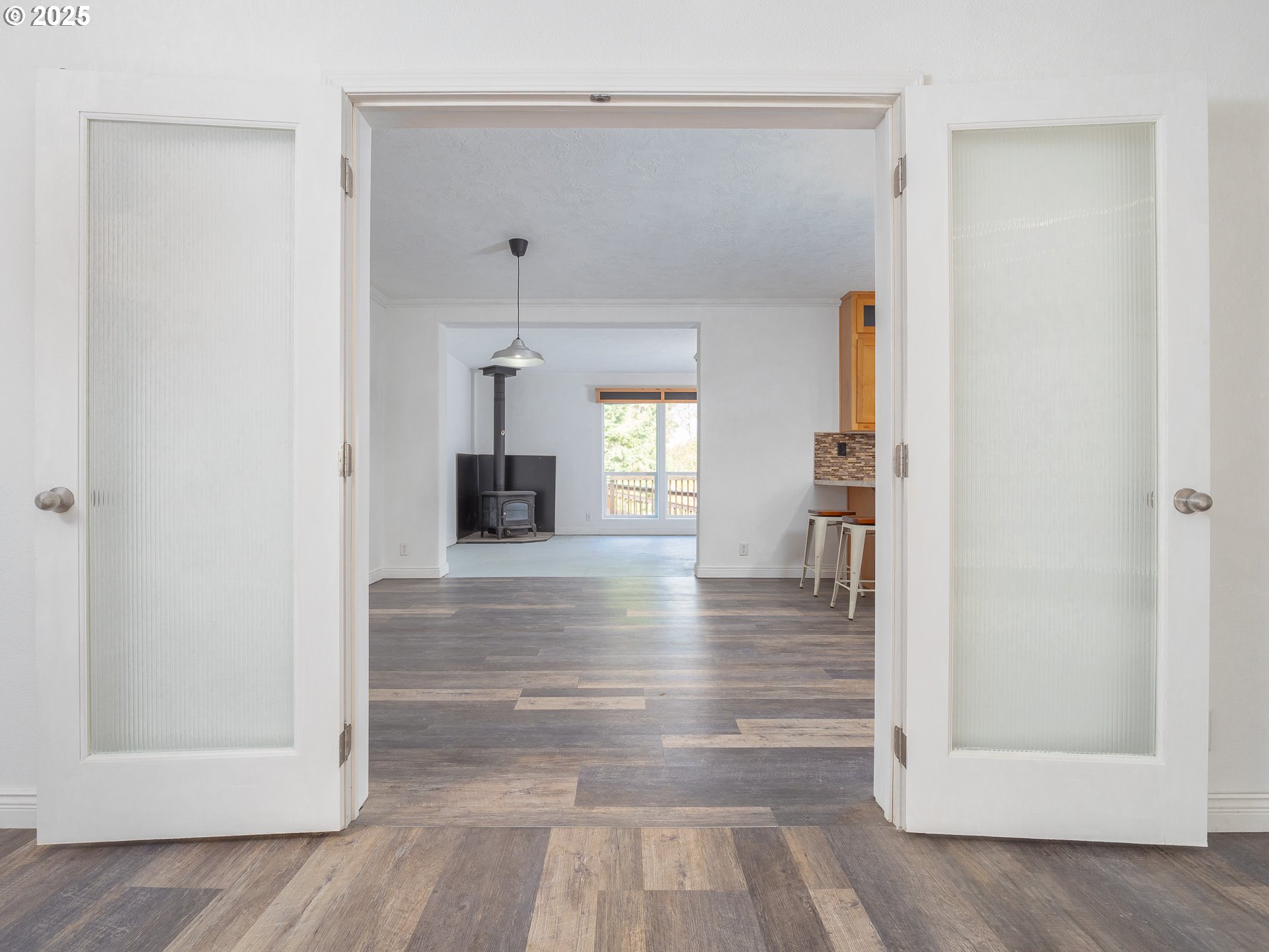 44300 Southeast Sandercock Lane Sandy, OR 97055 - Photo 12 of 48 a view of a hallway view with wooden floor and staircase