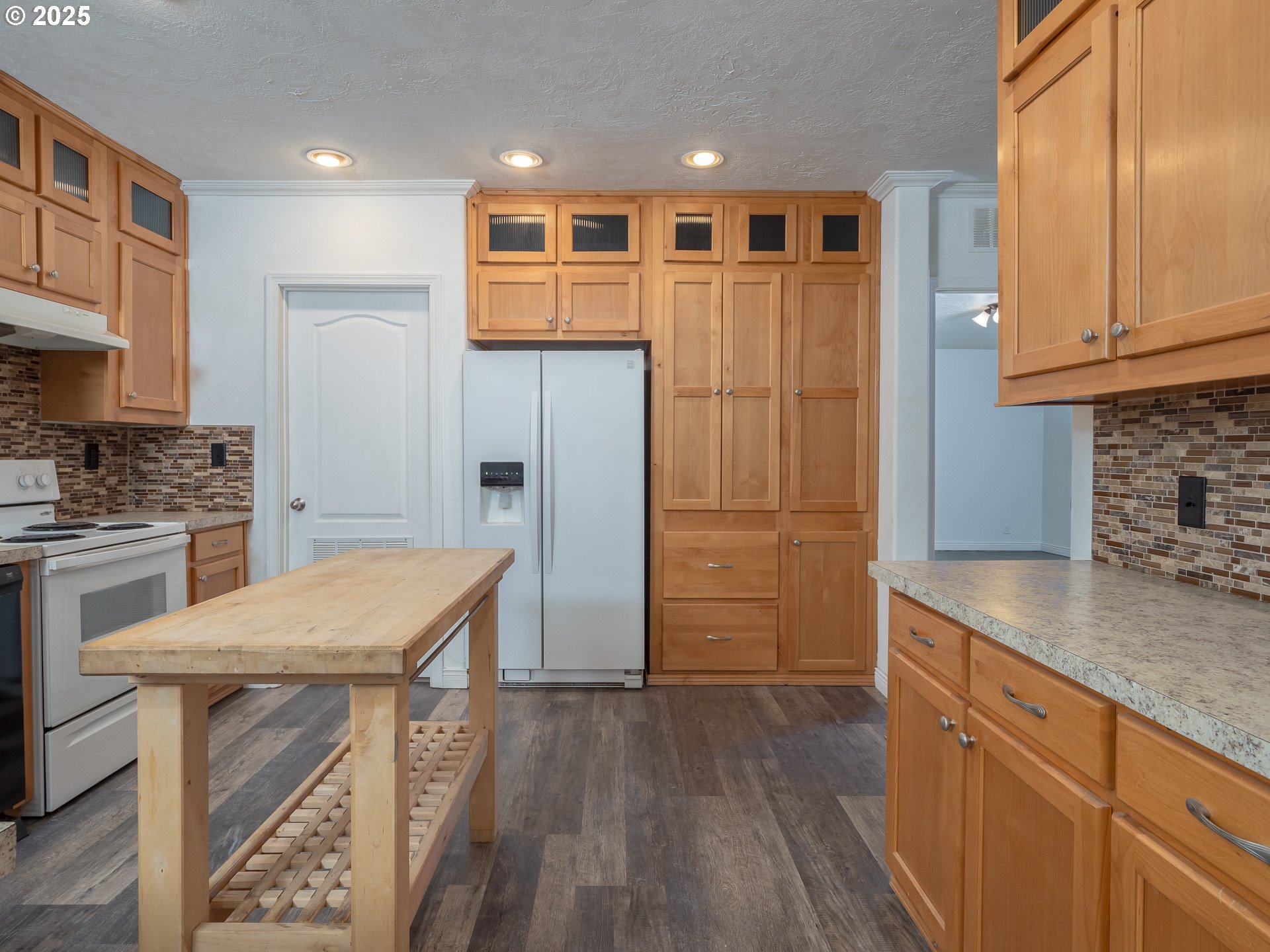 44300 Southeast Sandercock Lane Sandy, OR 97055 - Photo 15 of 48 a kitchen with stainless steel appliances granite countertop a refrigerator and a stove top oven