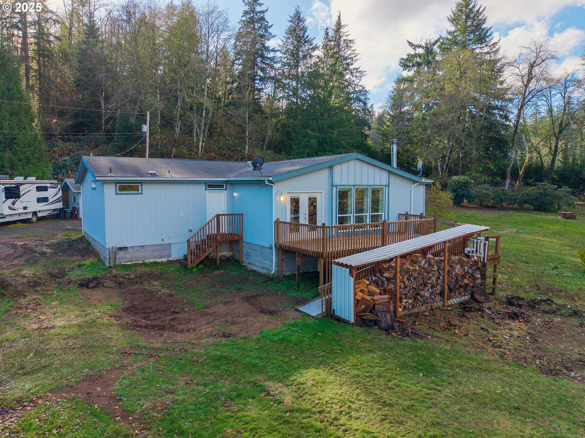 44300 Southeast Sandercock Lane Sandy, OR 97055 - Photo 2 of 48 a view of a house with a yard and deck