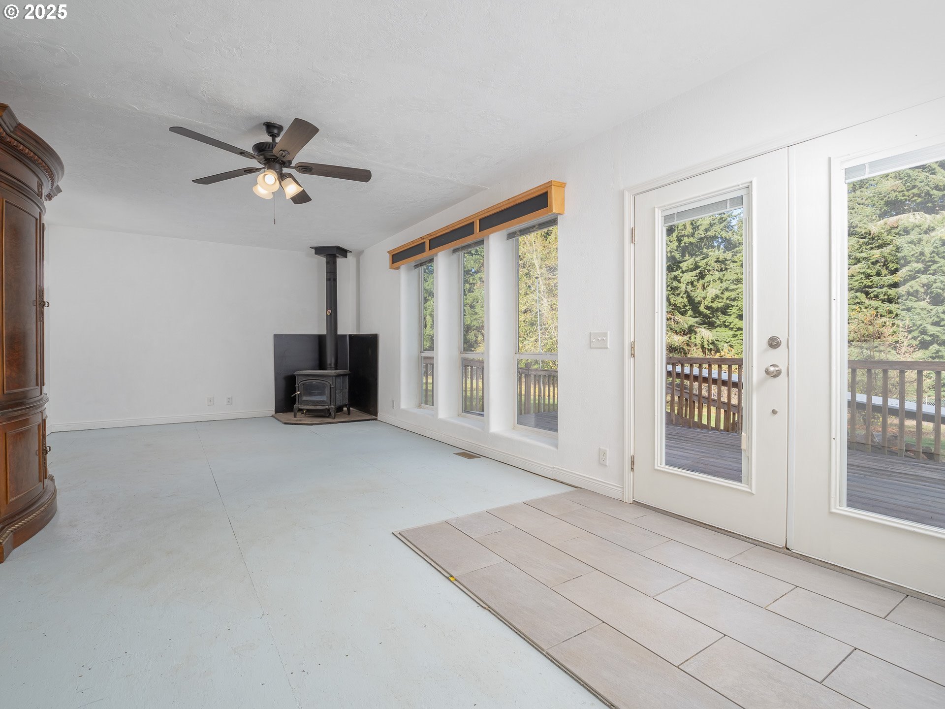 44300 Southeast Sandercock Lane Sandy, OR 97055 - Photo 22 of 48 a view of empty room with wooden floor and fan