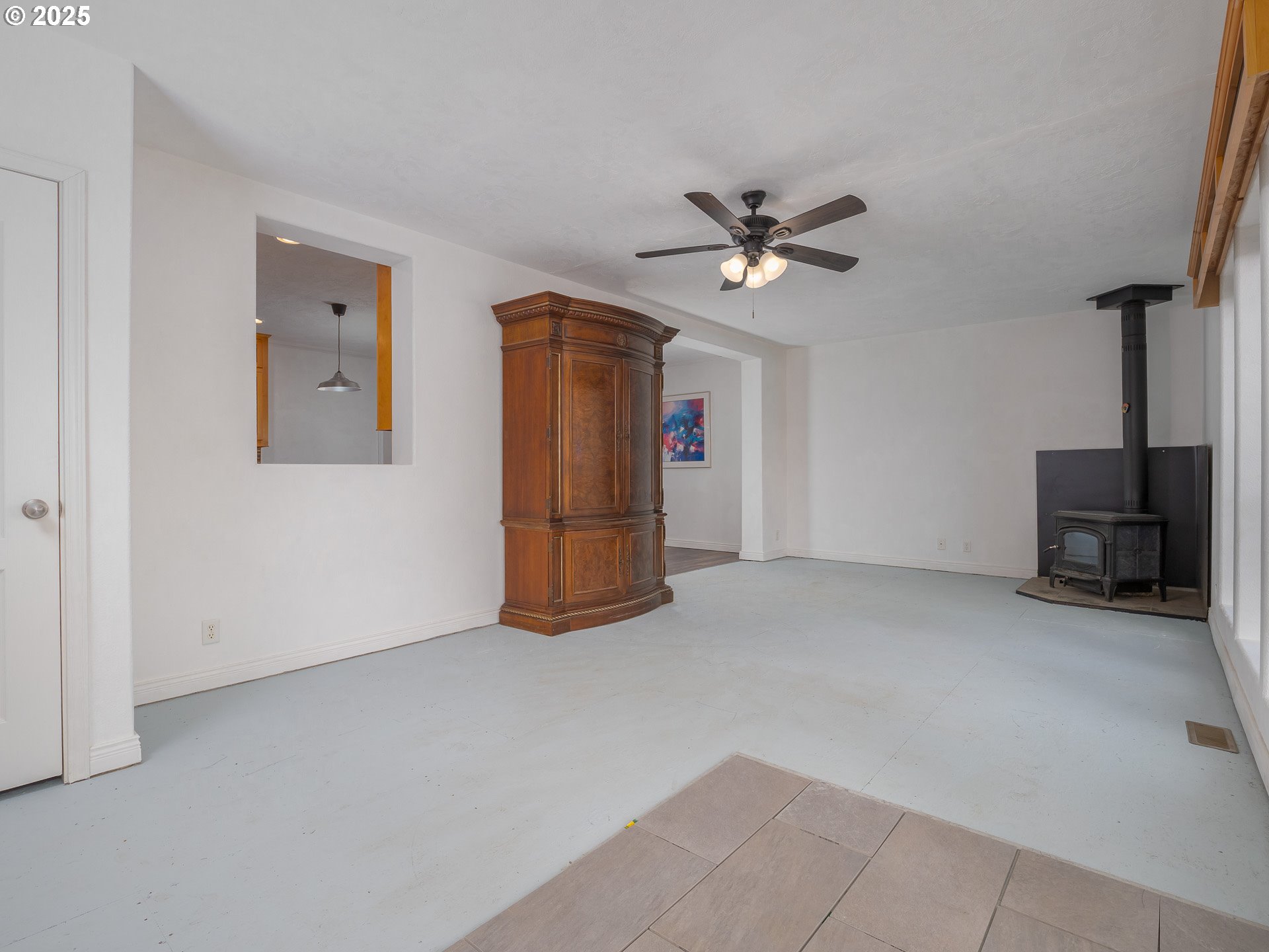 44300 Southeast Sandercock Lane Sandy, OR 97055 - Photo 24 of 48 a view of an empty room with a ceiling fan