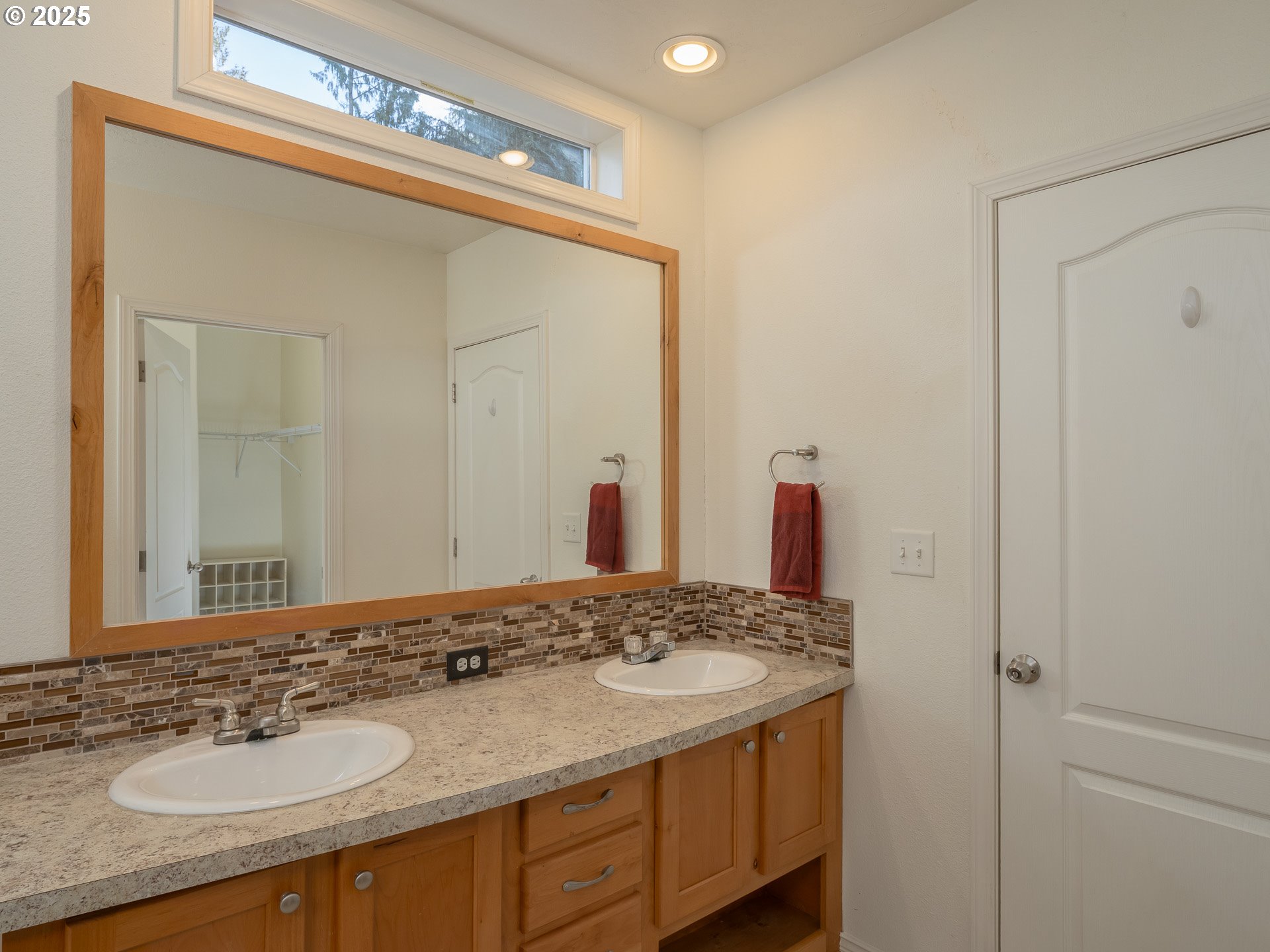 44300 Southeast Sandercock Lane Sandy, OR 97055 - Photo 28 of 48 a bathroom with a sink vanity and a mirror