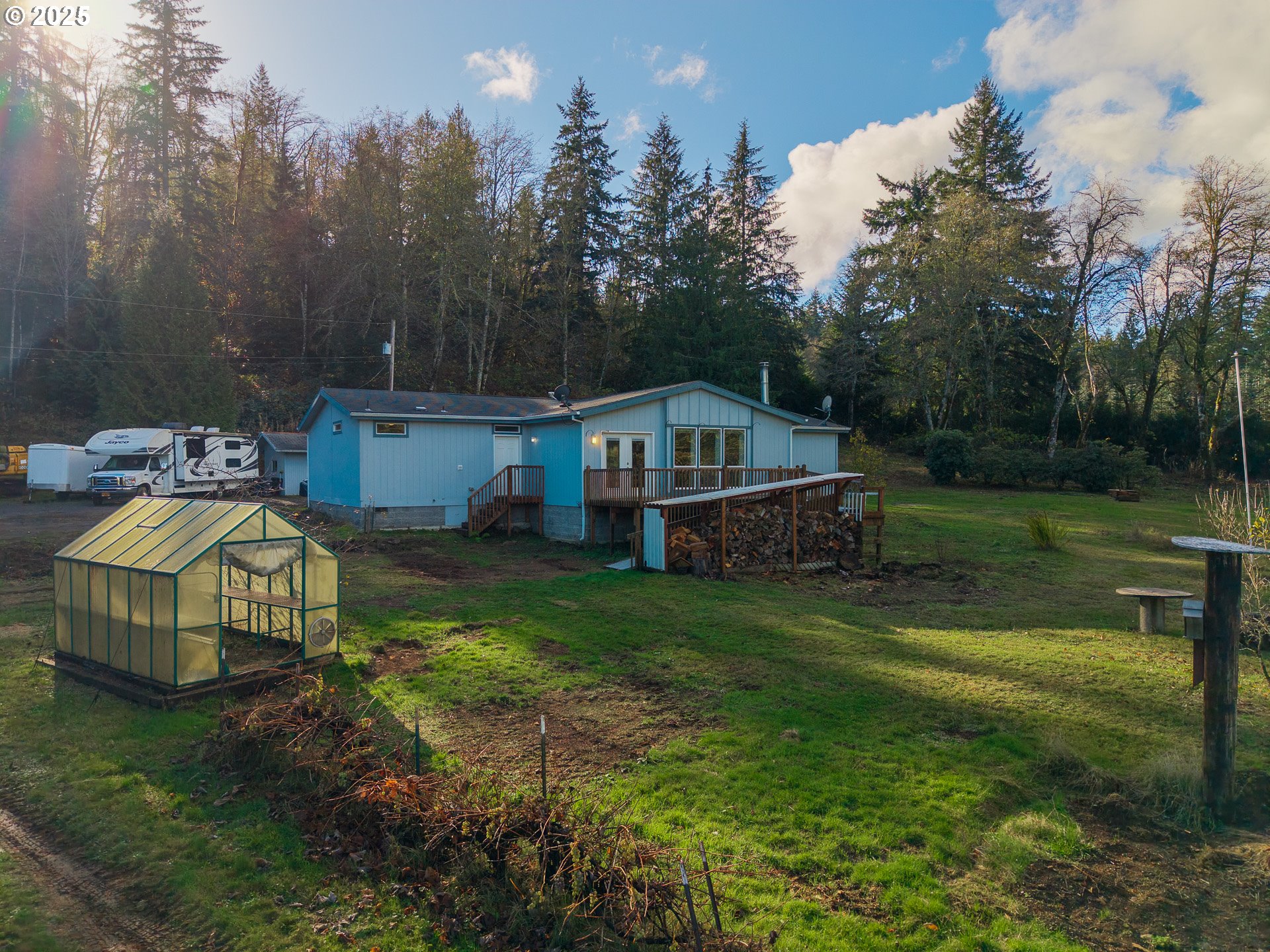 44300 Southeast Sandercock Lane Sandy, OR 97055 - Photo 38 of 48 a view of a house with a yard