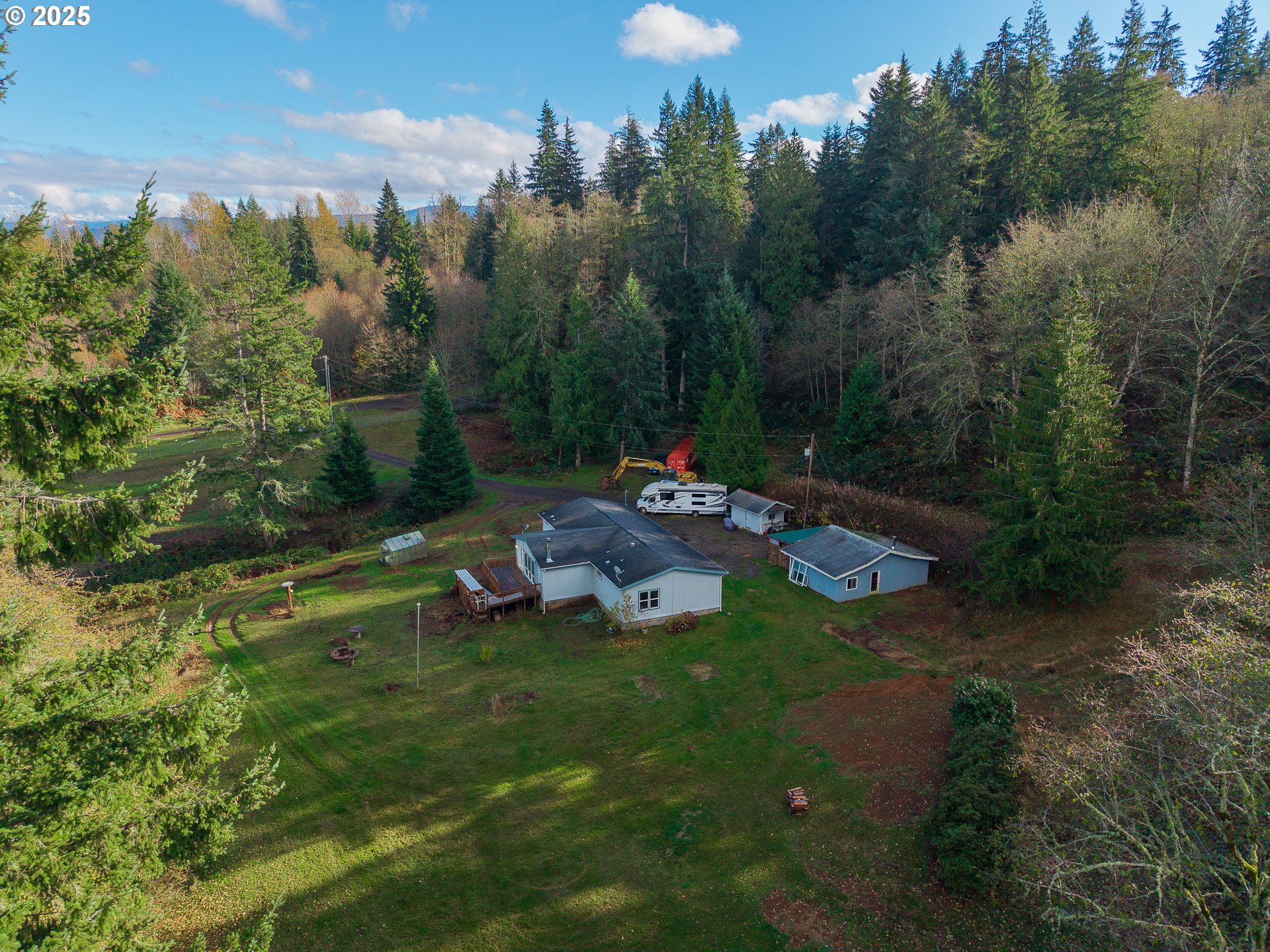 44300 Southeast Sandercock Lane Sandy, OR 97055 - Photo 44 of 48 a view of a backyard with a garden