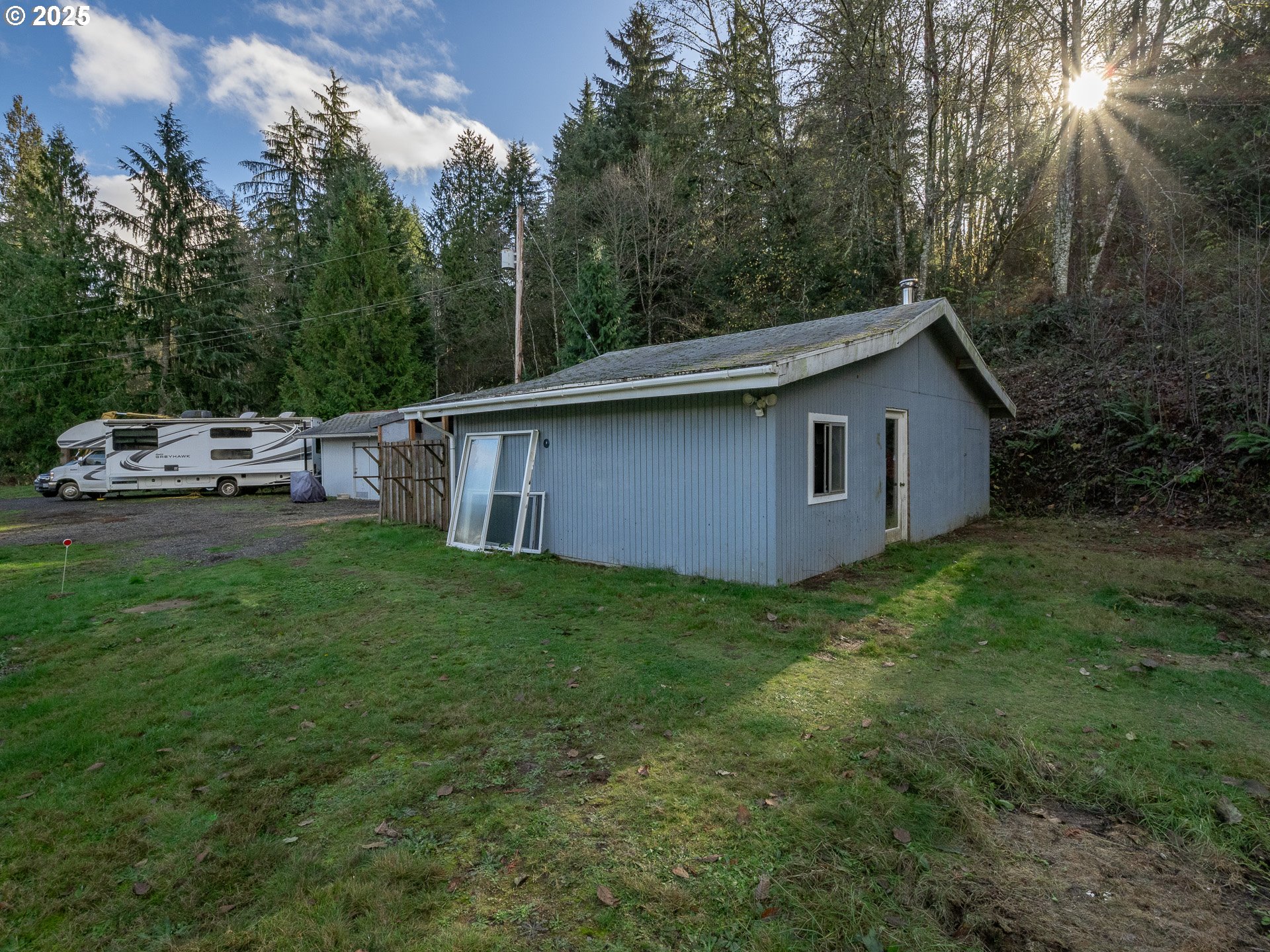 44300 Southeast Sandercock Lane Sandy, OR 97055 - Photo 46 of 48 a view of a backyard with a garden