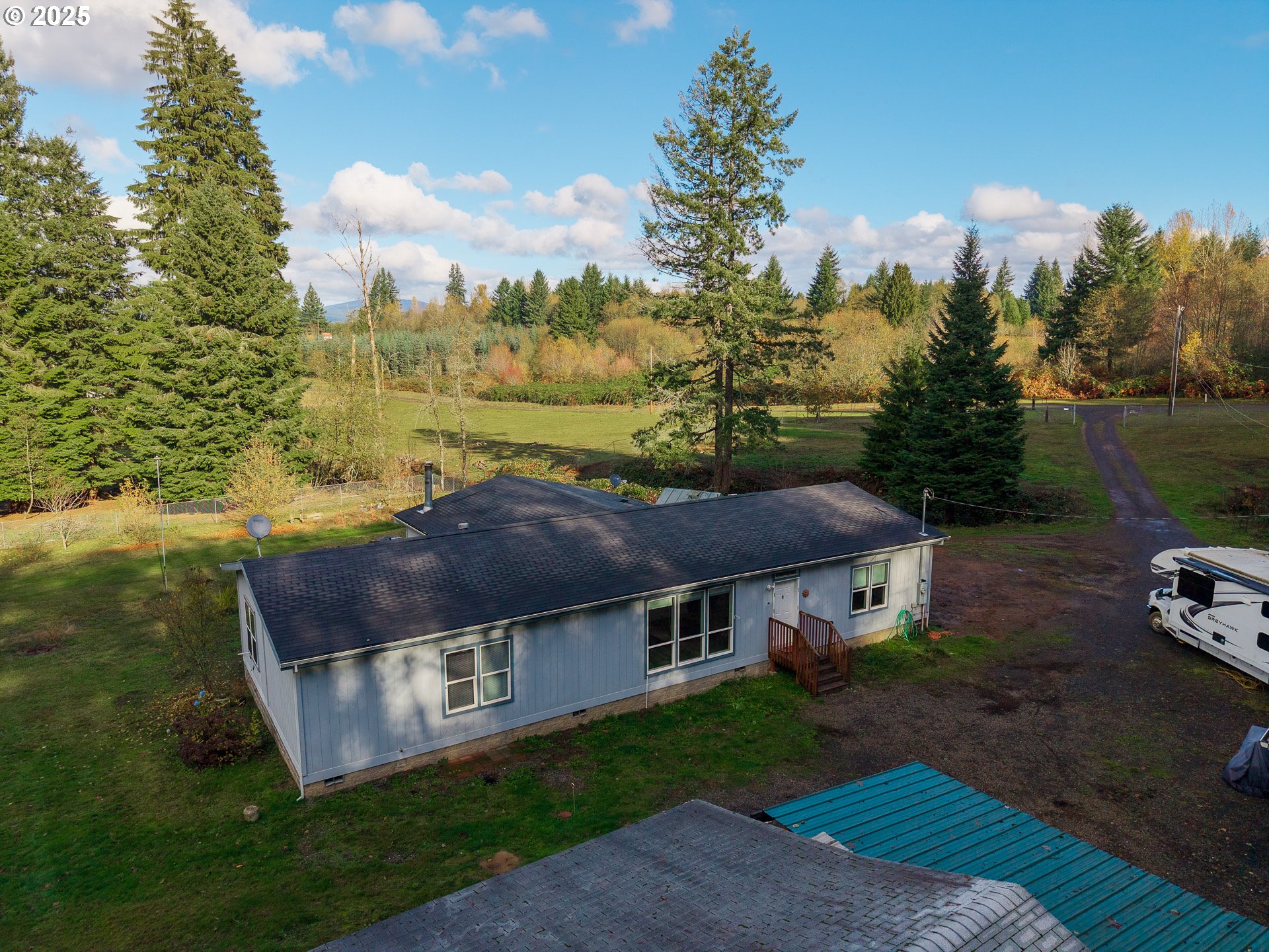 44300 Southeast Sandercock Lane Sandy, OR 97055 - Photo 5 of 48 a view of a house with a yard