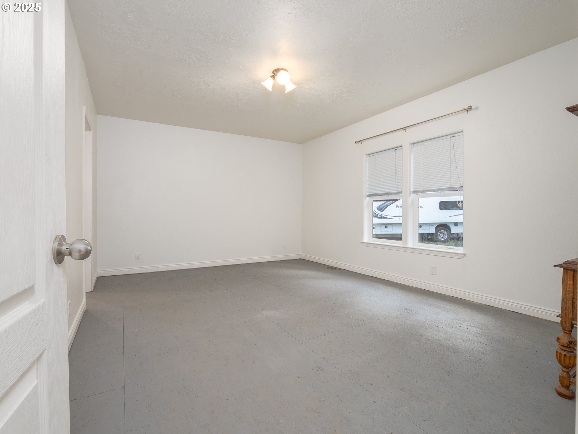 44300 Southeast Sandercock Lane Sandy, OR 97055 - Photo 7 of 48 an empty room with windows and entrance