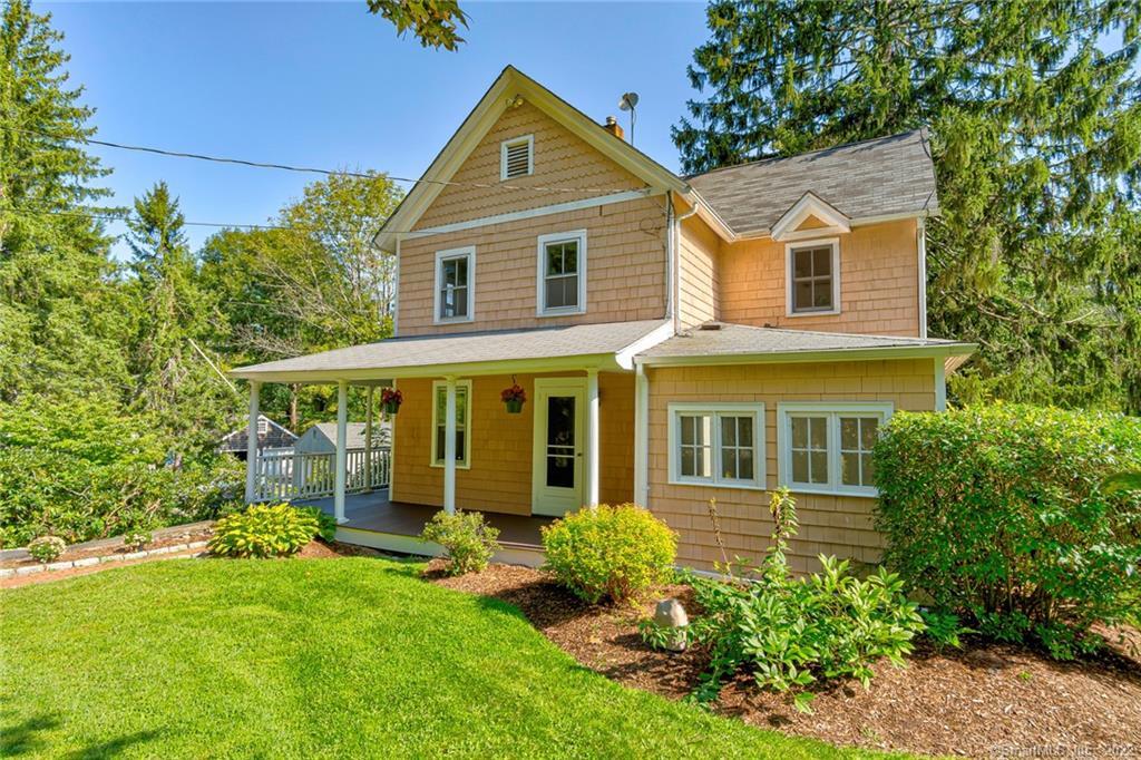 132 Ramapoo Road Ridgefield, CT 06877 - Photo 1 of 1 a view of a house with a yard