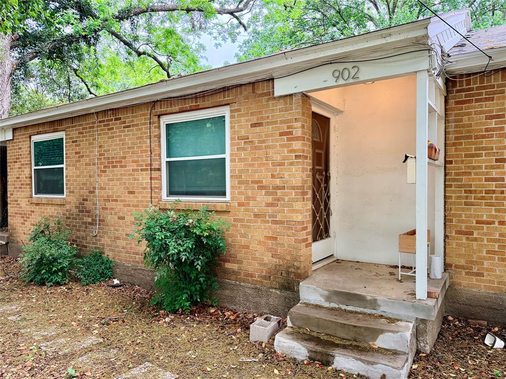 Classic brick home tucked away in a quiet, wooded setting.