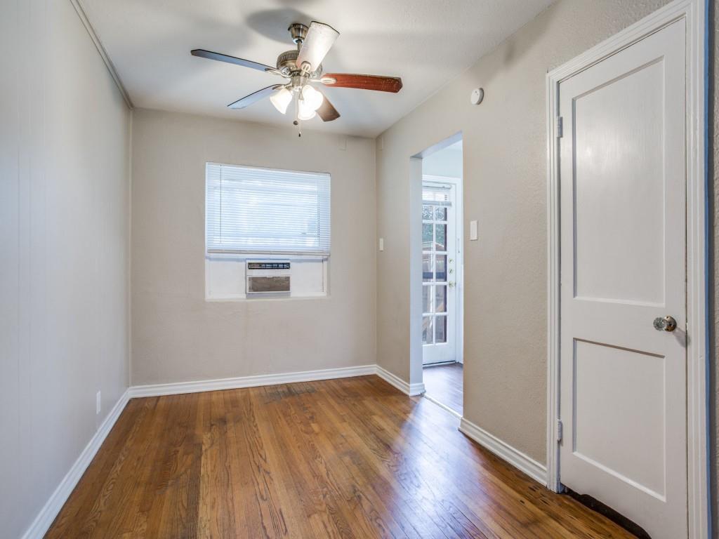 902 Denton Street Denton, TX 76201 - Photo 3 of 11 Cozy bedroom with a ceiling fan and a view of the outdoors.