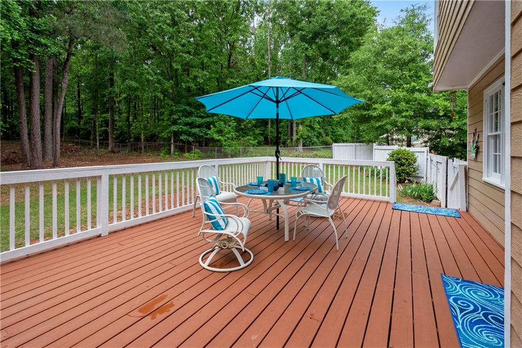 405 Ridgemont Drive Fayetteville, GA 30215 - Photo 32 of 43 a view of balcony with wooden floor and outdoor seating