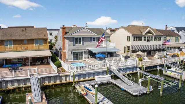 a aerial view of a house with swimming pool and sitting area