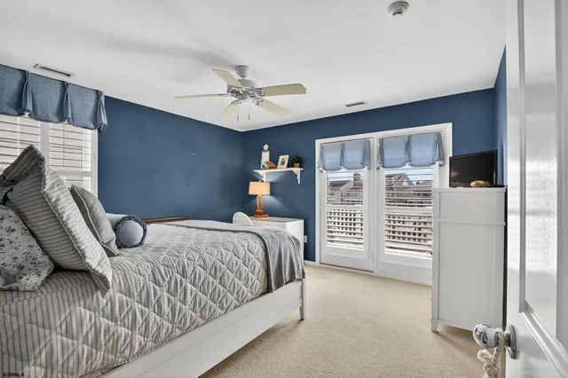 a bedroom with a bed dresser and a walk in closet