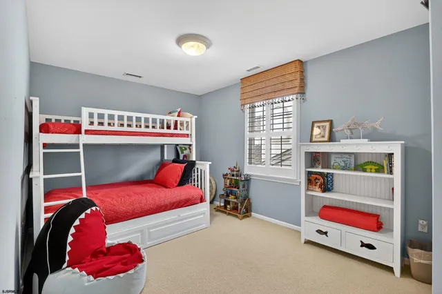 a bedroom with bed and a window