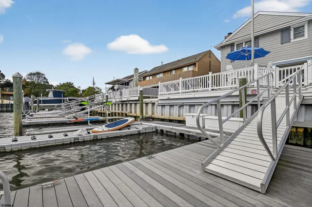 a view of a house with wooden deck
