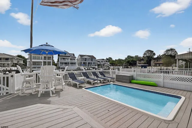 a view of a chairs and table on the wooden floor