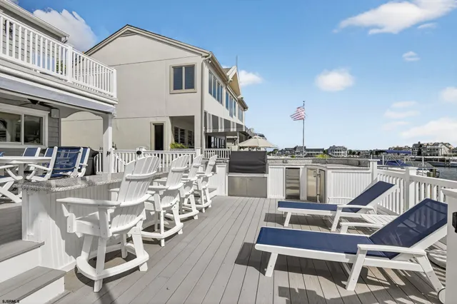 a view of a patio with table and chairs with wooden floor
