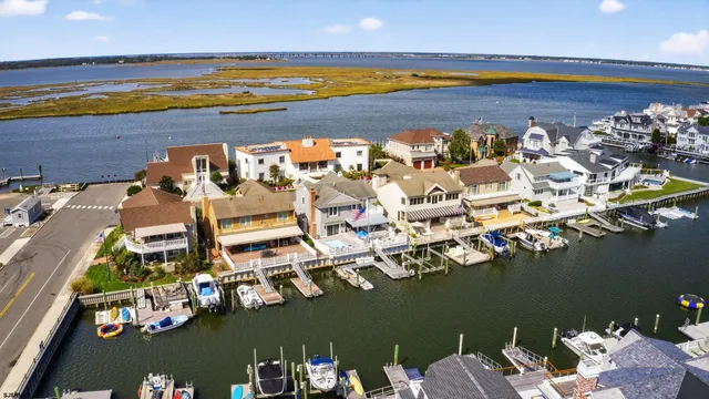 an aerial view of a house with a ocean view