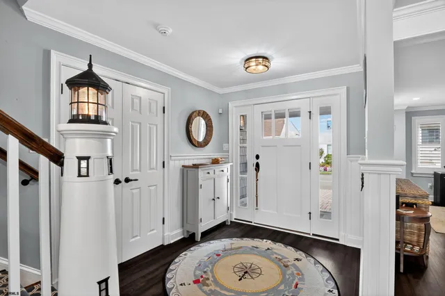 a view of a livingroom with wooden floor and a window