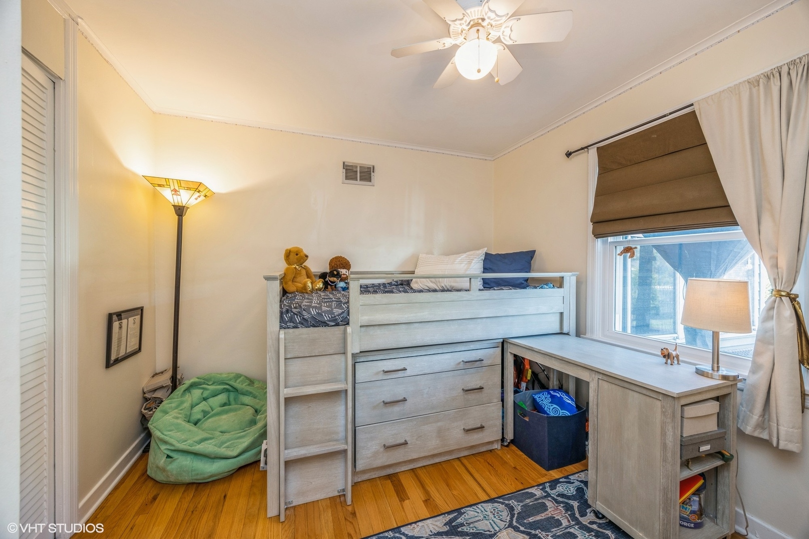 9542 Monroe Avenue Brookfield, IL 60513 - Photo 11 of 21 a bedroom with a bed and a chandelier