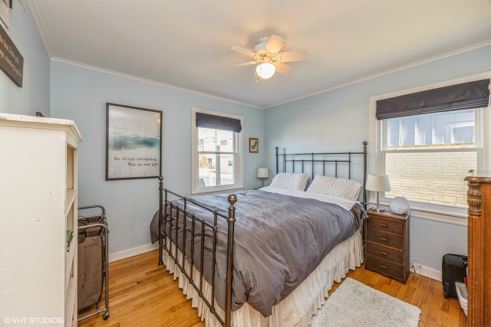9542 Monroe Avenue Brookfield, IL 60513 - Photo 14 of 21 a bedroom with a bed next to a window with a flat screen tv