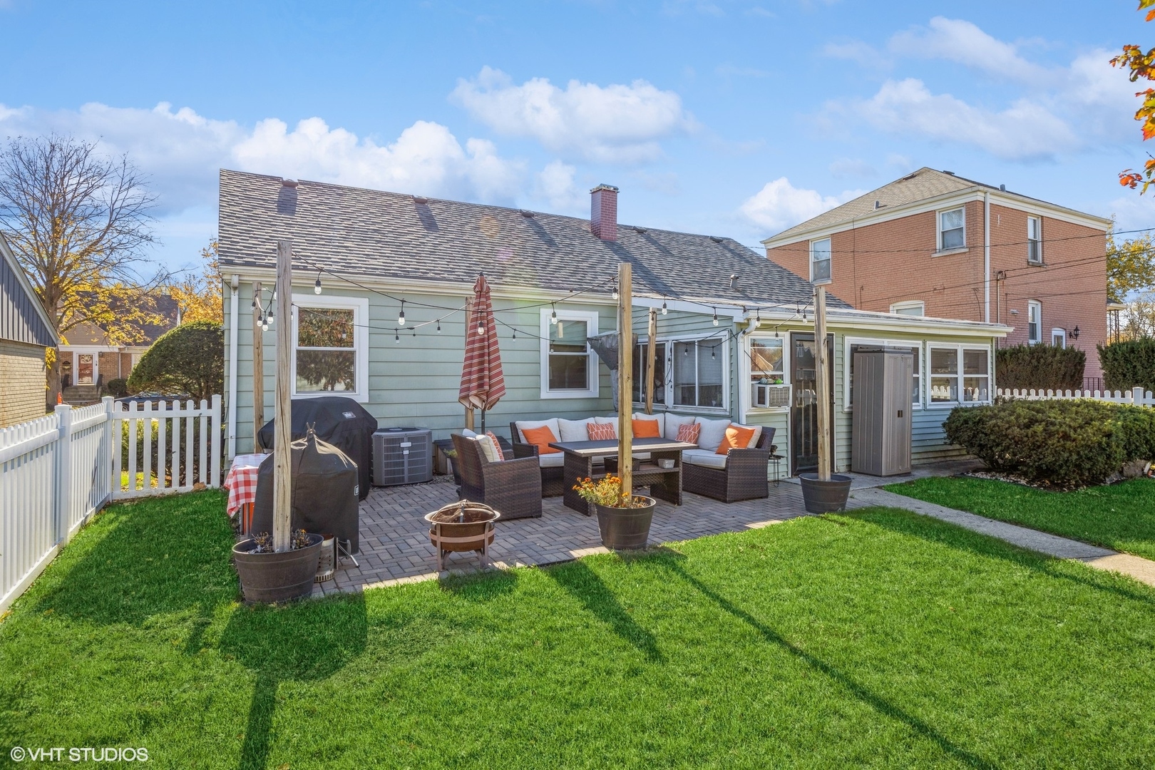 9542 Monroe Avenue Brookfield, IL 60513 - Photo 20 of 21 a view of a house with a backyard and a patio