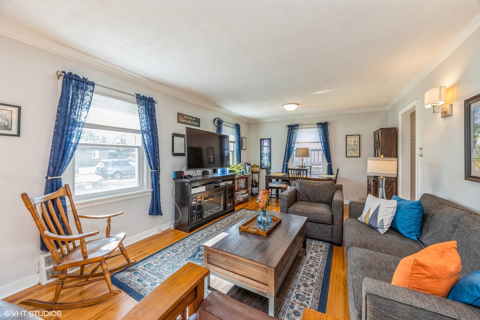 9542 Monroe Avenue Brookfield, IL 60513 - Photo 3 of 21 a living room with furniture a flat screen tv and a window