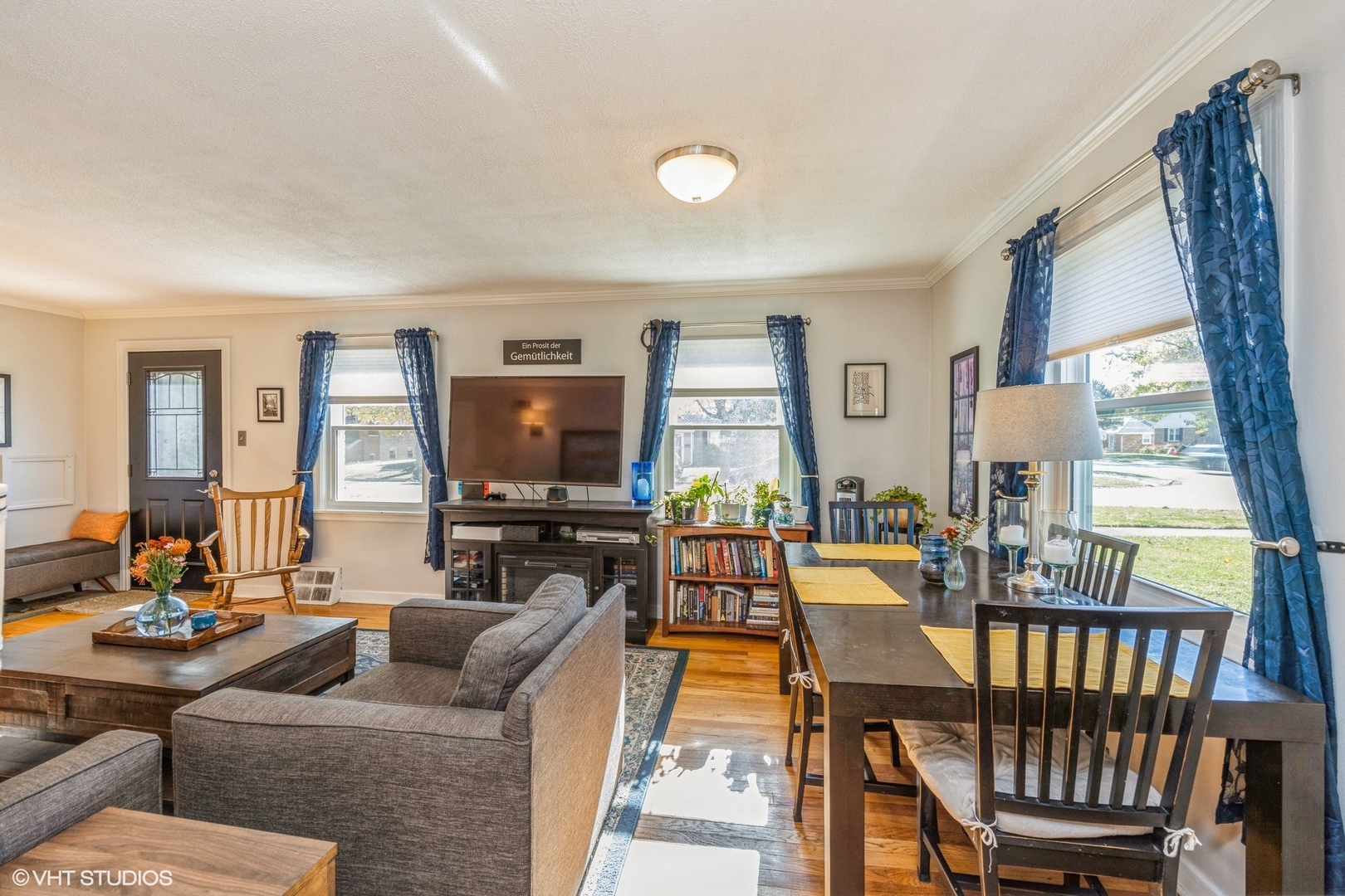 9542 Monroe Avenue Brookfield, IL 60513 - Photo 6 of 21 a living room with furniture a flat screen tv and a large window