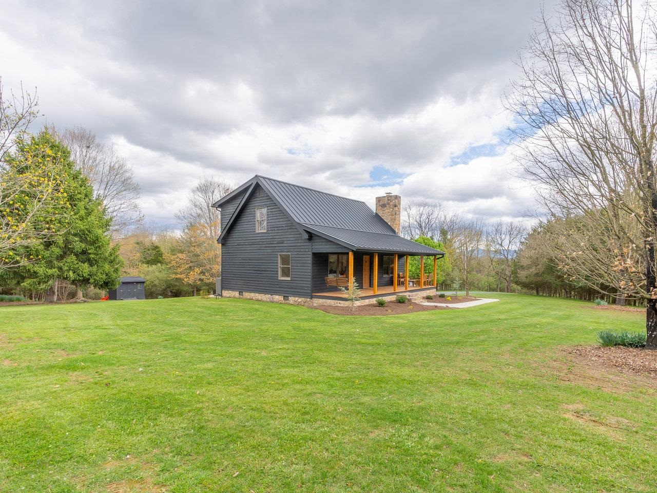 6041 Williams Run Road Port Republic, VA 24471 - Photo 49 of 68 a view of a big house with a big yard and large trees