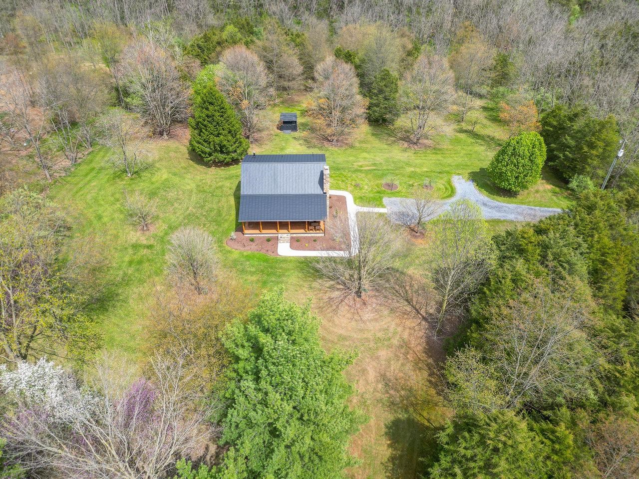 6041 Williams Run Road Port Republic, VA 24471 - Photo 53 of 68 a view of a yard with table and chairs and wooden fence