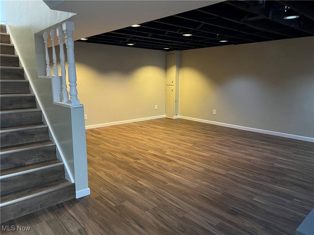 1715 Toepfer Road Akron, OH 44312 - Photo 29 of 49 Basement featuring dark hardwood / wood-style flooring