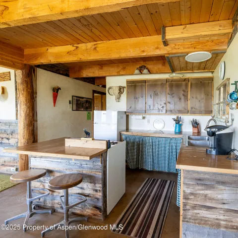 a kitchen with a stove and a refrigerator