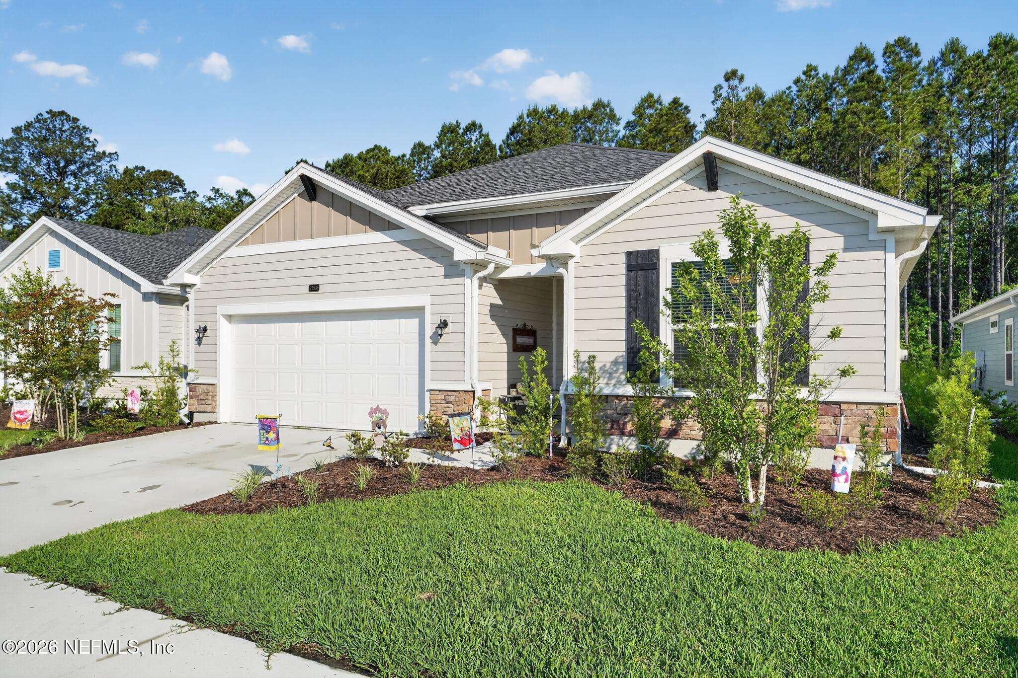 75505 Banyan Way Yulee, FL 32097 - Photo 2 of 30 a view of a house with backyard and garden
