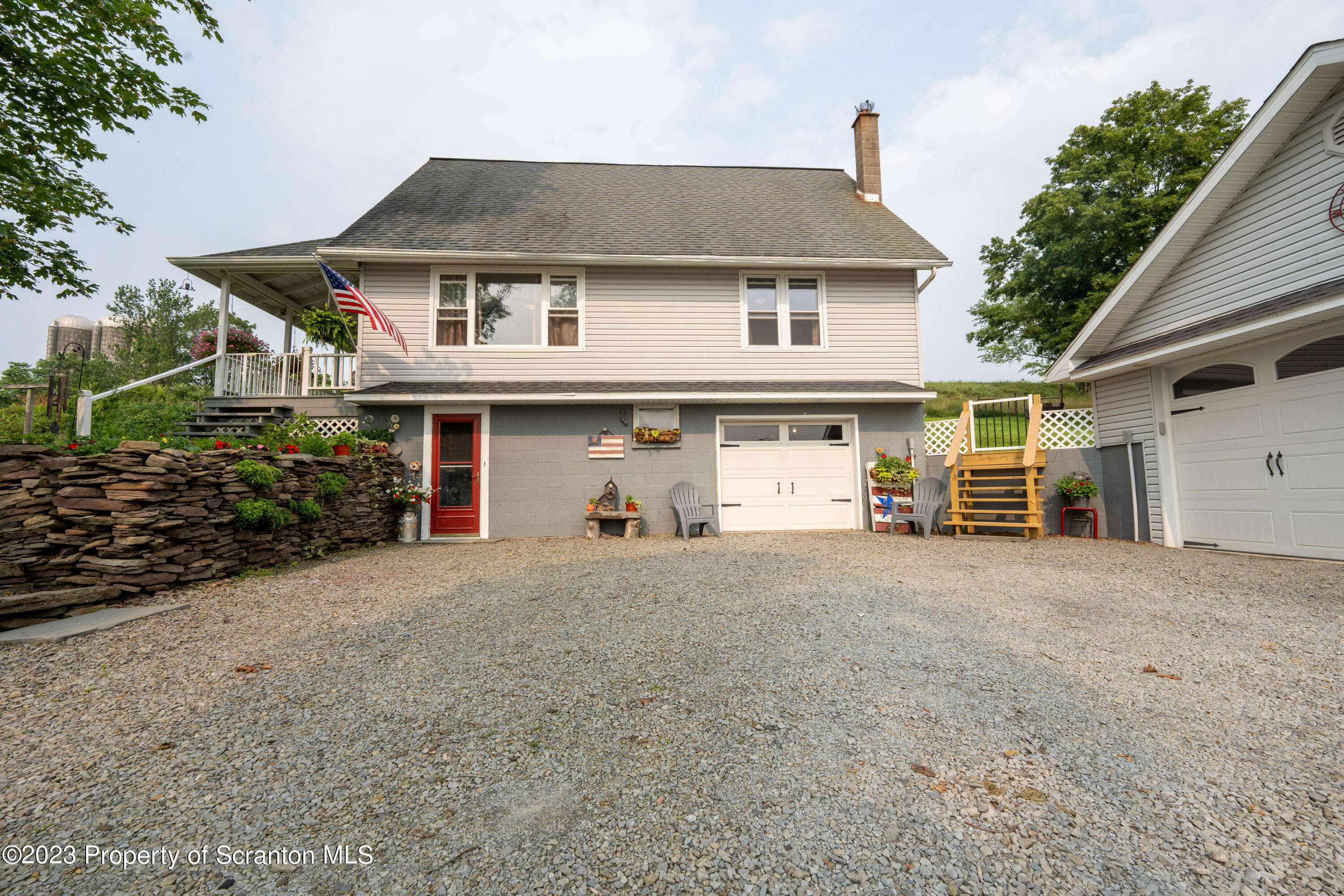 2759 State Rte 3011 Meshoppen, PA 18630 - Photo 1 of 30 a view of a house with a yard and garage
