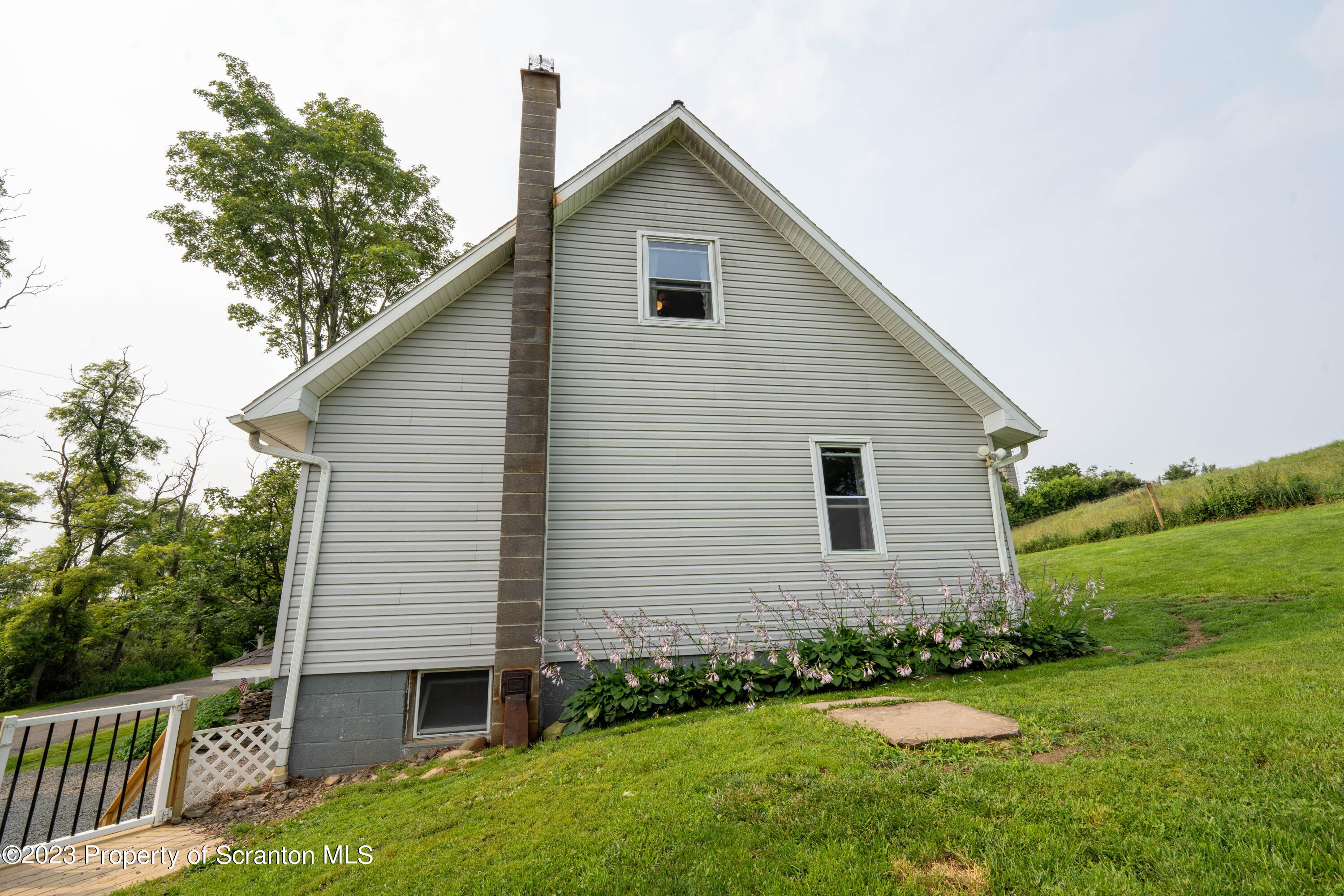 2759 State Rte 3011 Meshoppen, PA 18630 - Photo 27 of 30 a front view of a house with a yard and trees
