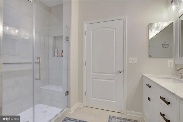 a bathroom with a shower and a sink