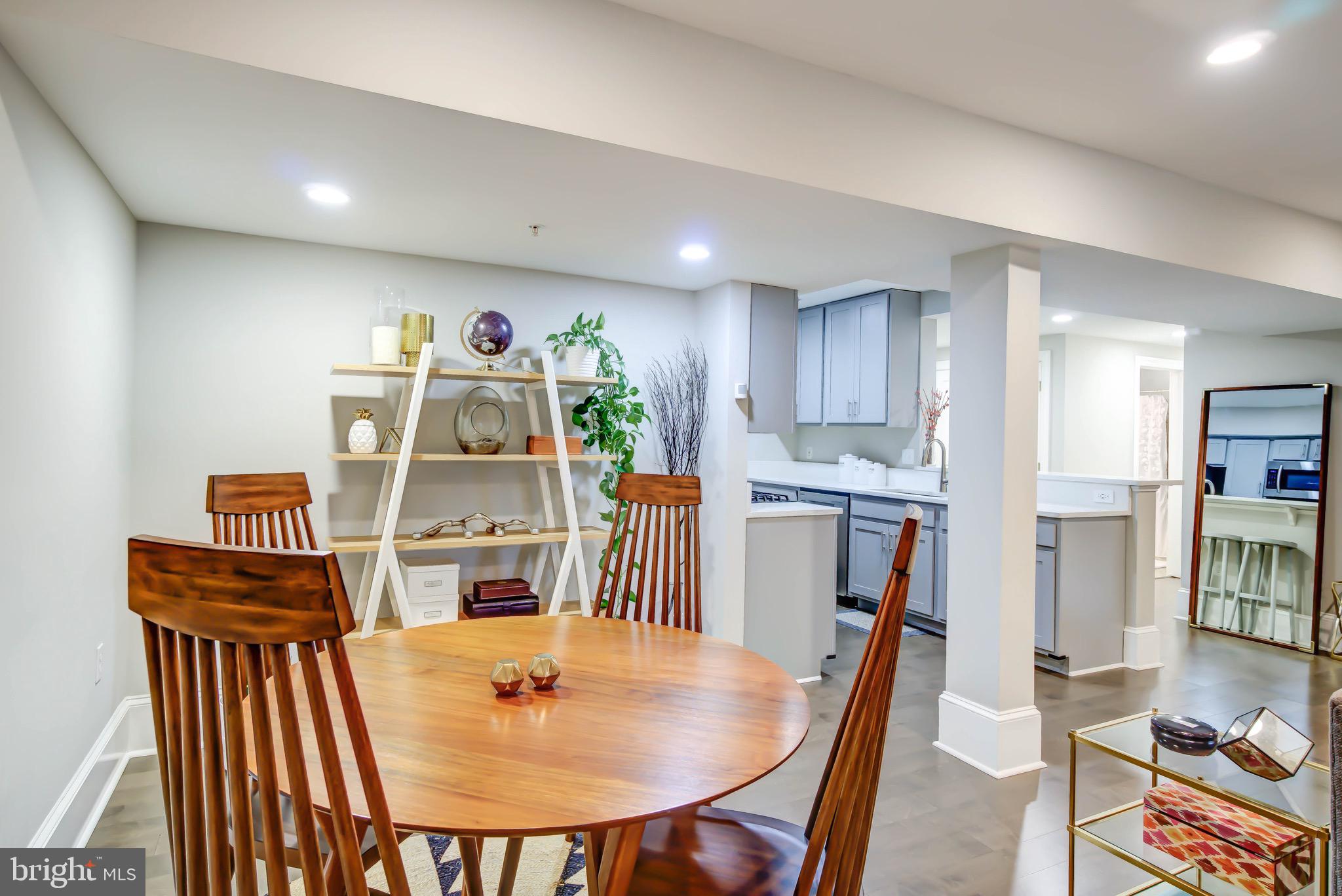 1324 Euclid Street Northwest, Unit 3 Washington, DC 20009 - Photo 11 of 23 a dining room with furniture and a floor to ceiling window