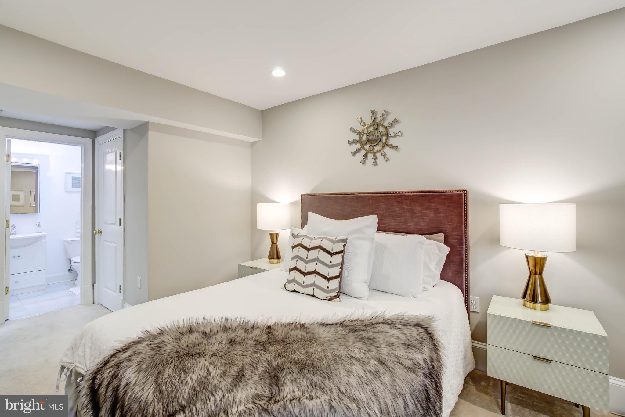 1324 Euclid Street Northwest, Unit 3 Washington, DC 20009 - Photo 12 of 23 a bedroom with a bed and a table