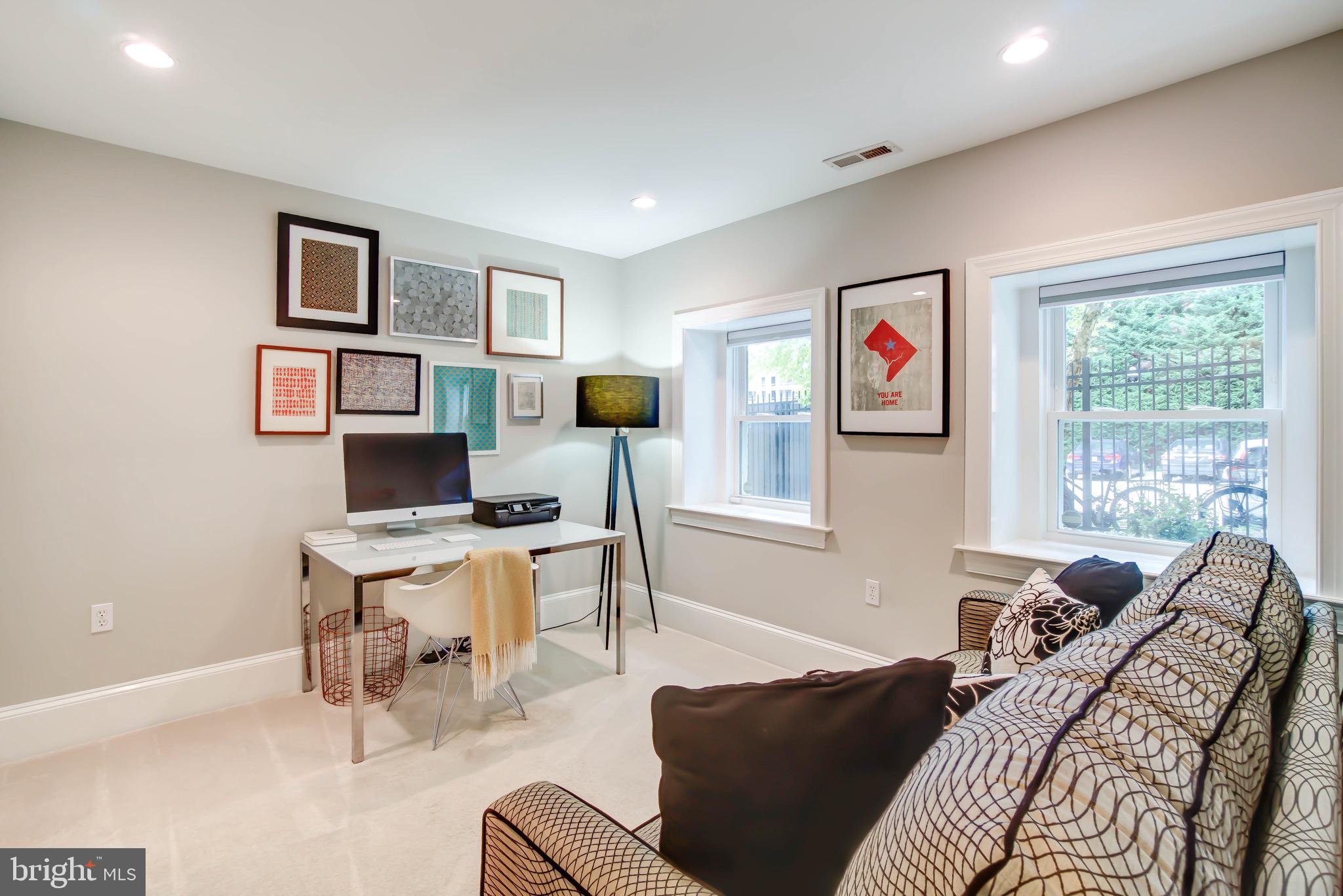 1324 Euclid Street Northwest, Unit 3 Washington, DC 20009 - Photo 15 of 23 a view of a livingroom with workspace and a window