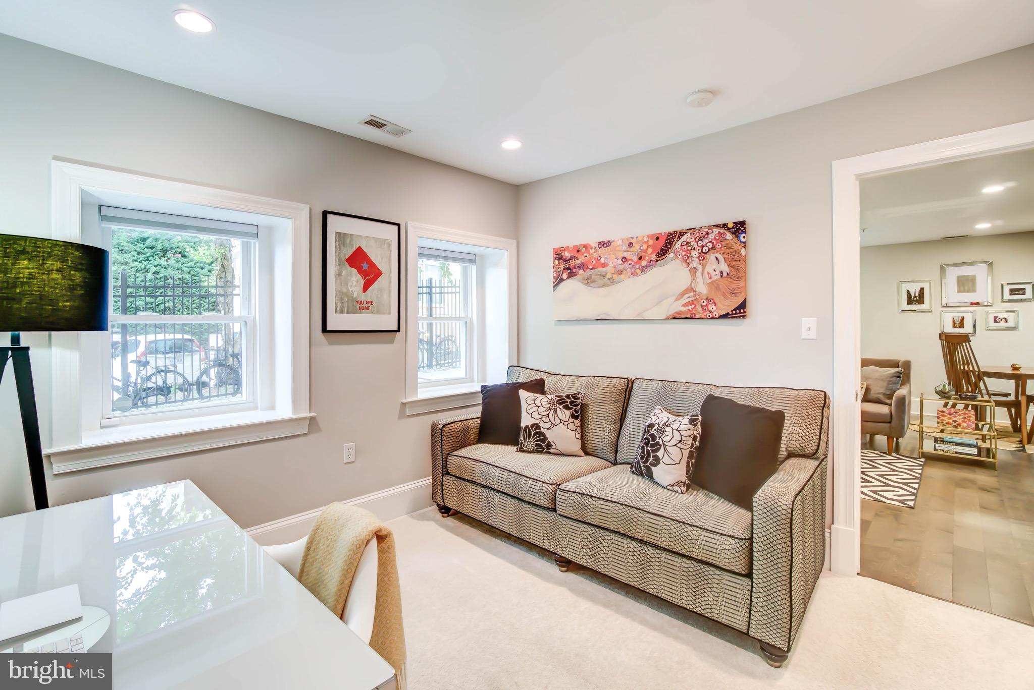 1324 Euclid Street Northwest, Unit 3 Washington, DC 20009 - Photo 16 of 23 a living room with furniture and a flat screen tv