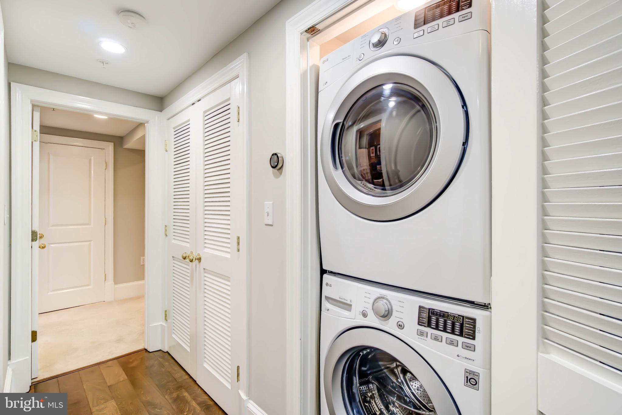 1324 Euclid Street Northwest, Unit 3 Washington, DC 20009 - Photo 18 of 23 a view of a hallway with washer and dryer