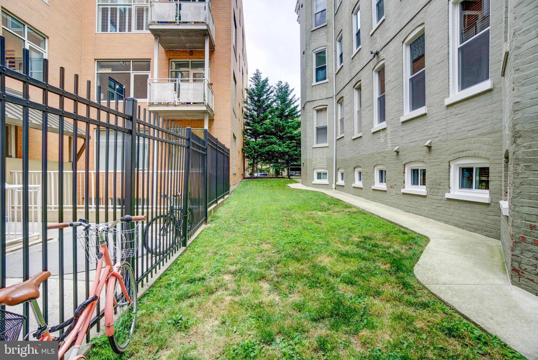 1324 Euclid Street Northwest, Unit 3 Washington, DC 20009 - Photo 21 of 23 a view of a brick house with many windows