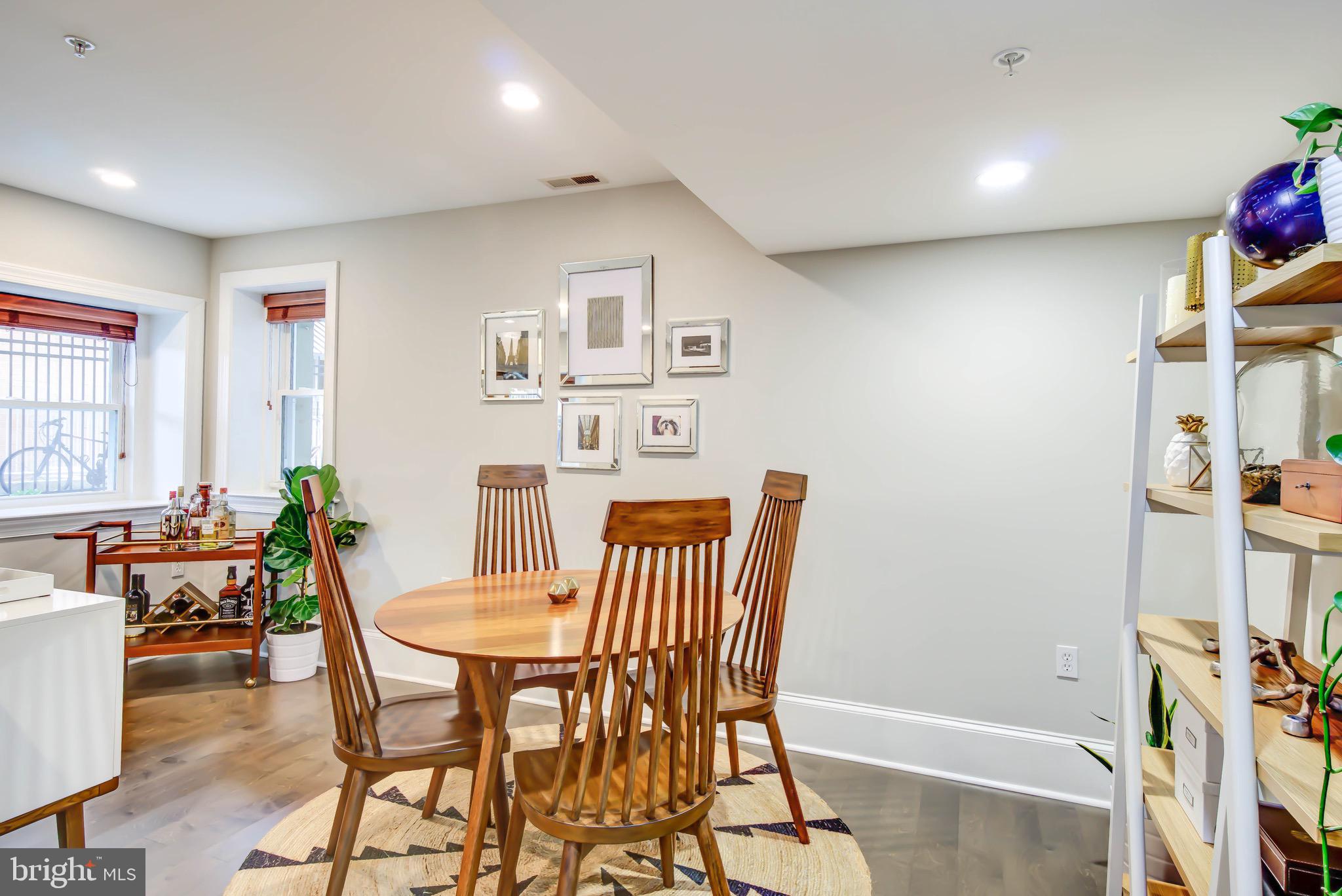 1324 Euclid Street Northwest, Unit 3 Washington, DC 20009 - Photo 10 of 23 a view of a dining room with furniture and a potted plant