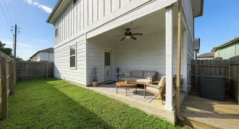 a view of backyard with seating space