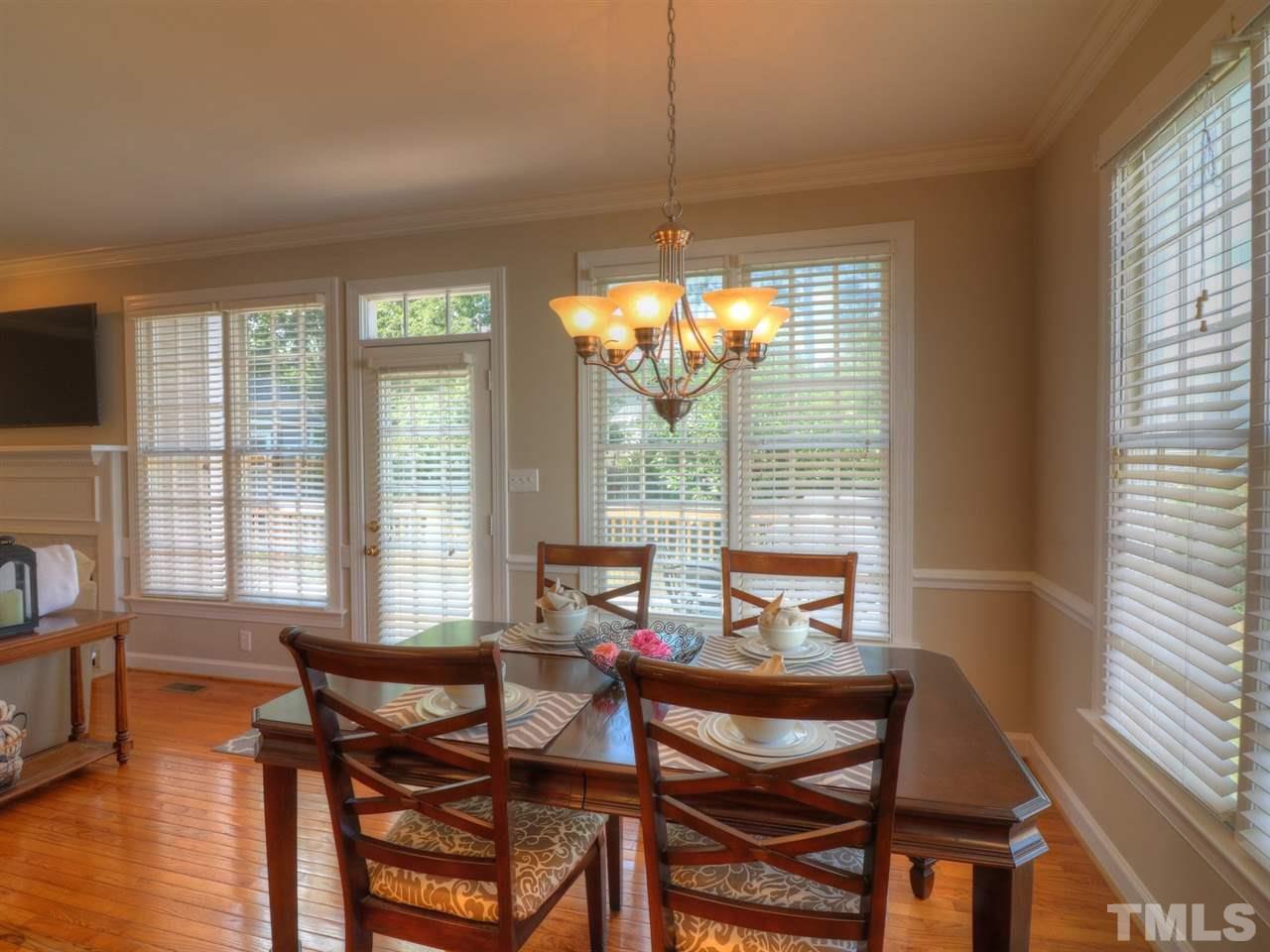 9304 Dawnshire Road Raleigh, NC 27615 - Photo 12 of 30 a view of a dining room with furniture and windows