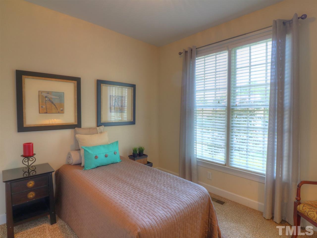 9304 Dawnshire Road Raleigh, NC 27615 - Photo 19 of 30 a bedroom with a bed and a window